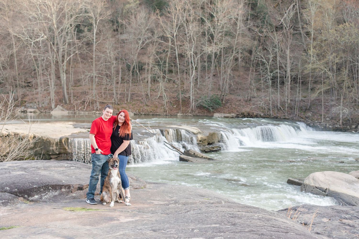 A scenic waterfall creates a dramatic backdrop for outdoor photography at a state park.