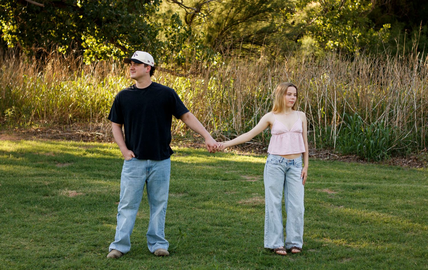 A couple holds hands during a couples photography session in Palo Duro Canyon State Park.