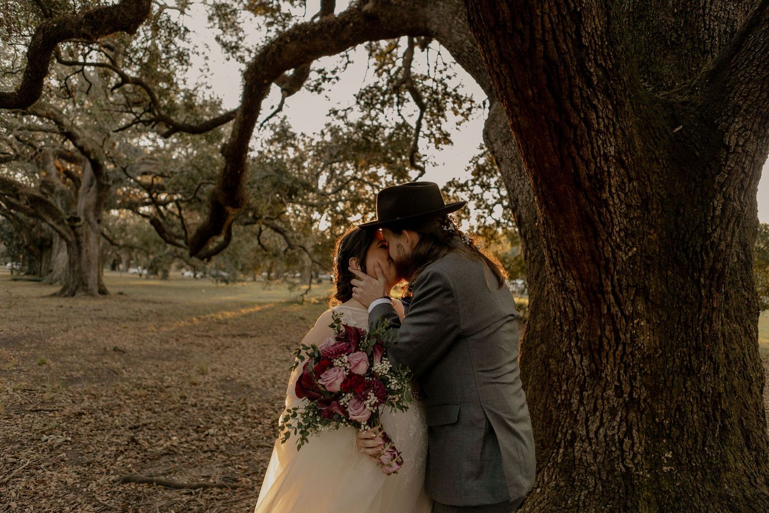 Bride and groom portraits in Audubon Park in New Orleans, LA. Photo by Castro Collective.