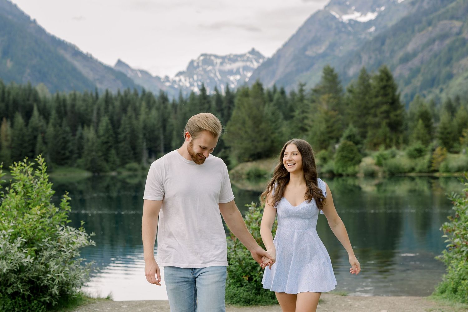 Seattle engagement session at Gold Creek Pond with mountain reflections and PNW scenery,