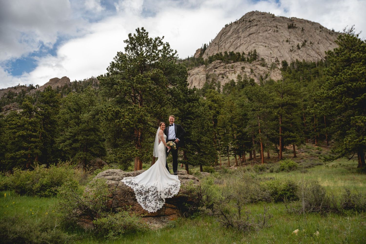 Bride & Groom Standing in Boulder in Estes Park Colorado