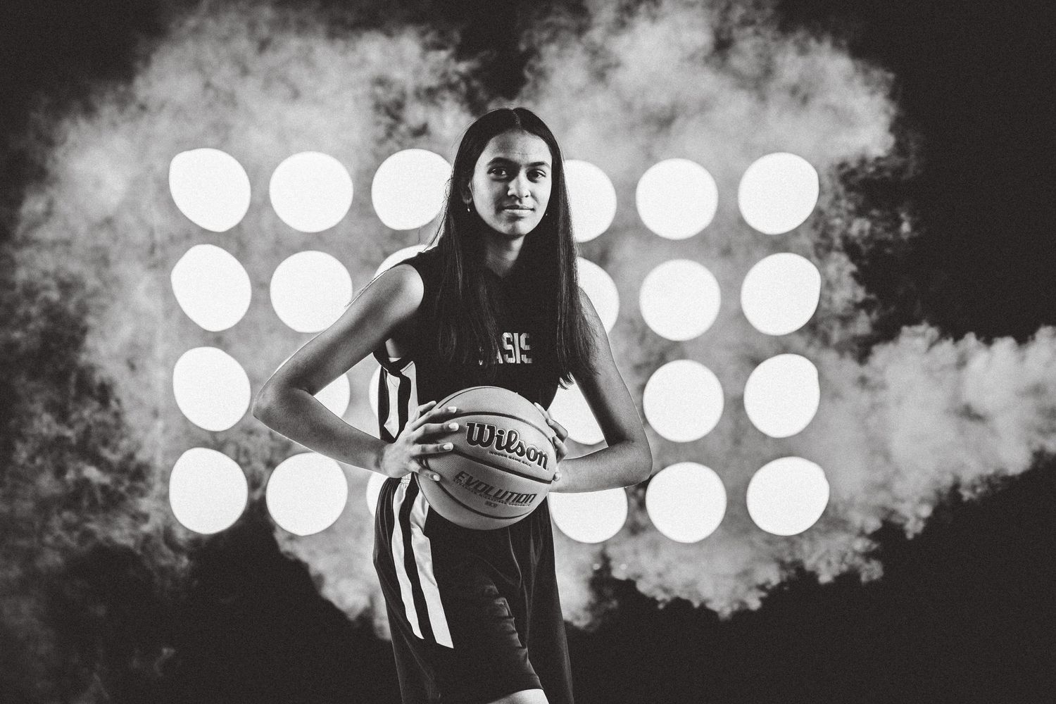 Kusuma Teluguntla poses with a basketball.
