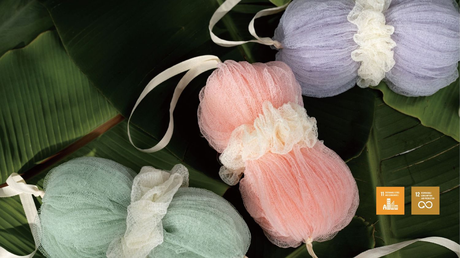 Decorative fabric sachets in pastel pink, purple, and mint green with ribbon ties.