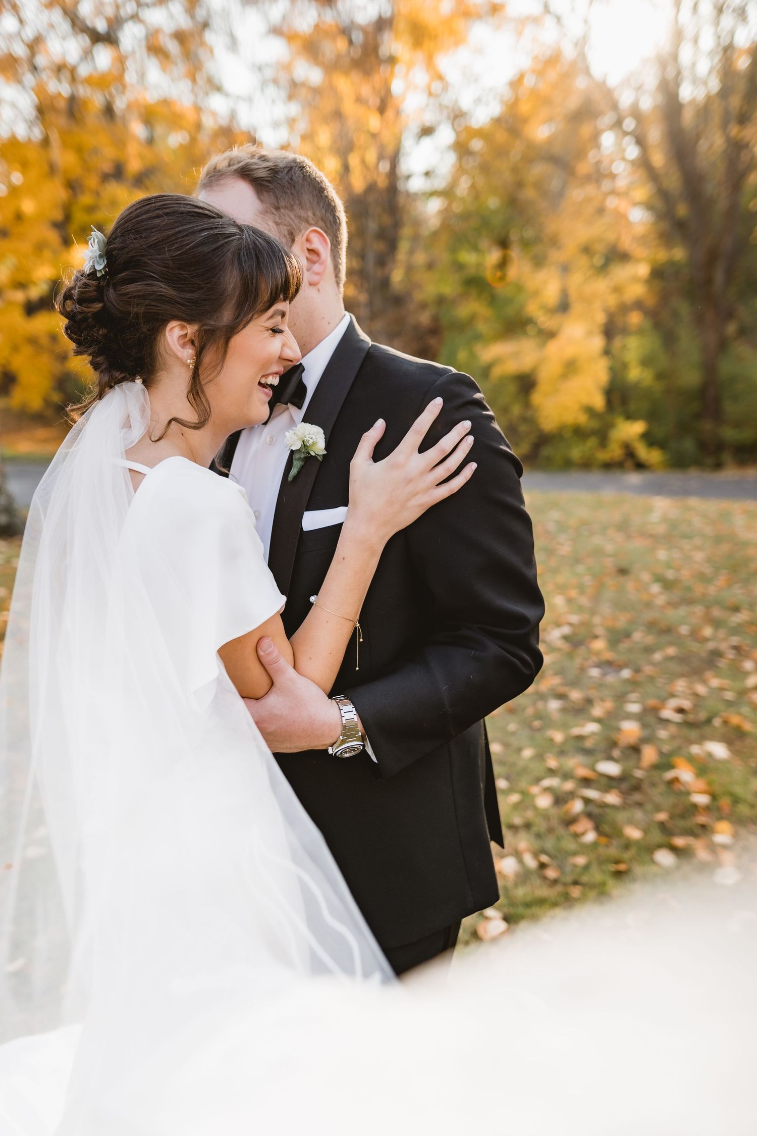 A couple laughing on their wedding day