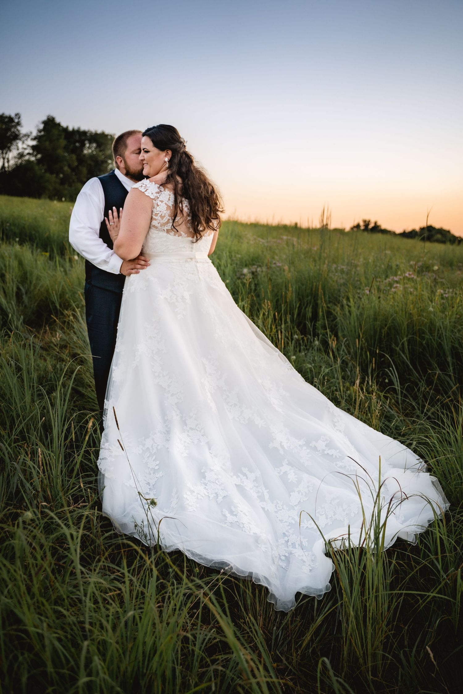 A bride an groom at blue hour in a prairie