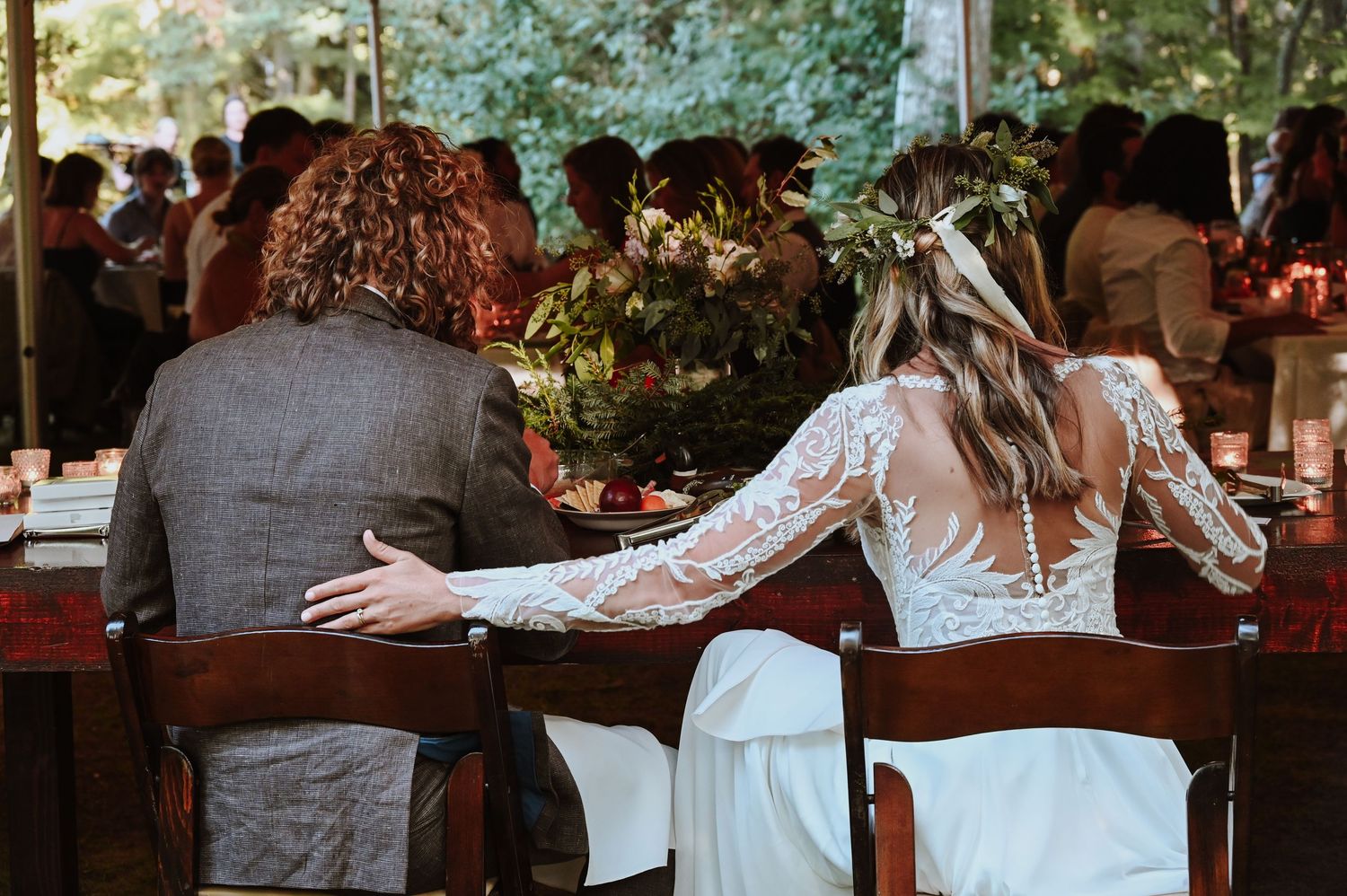A series of joyful moments captured in a grassy meadow wearing a cream-colored dress and holding wildflowers.