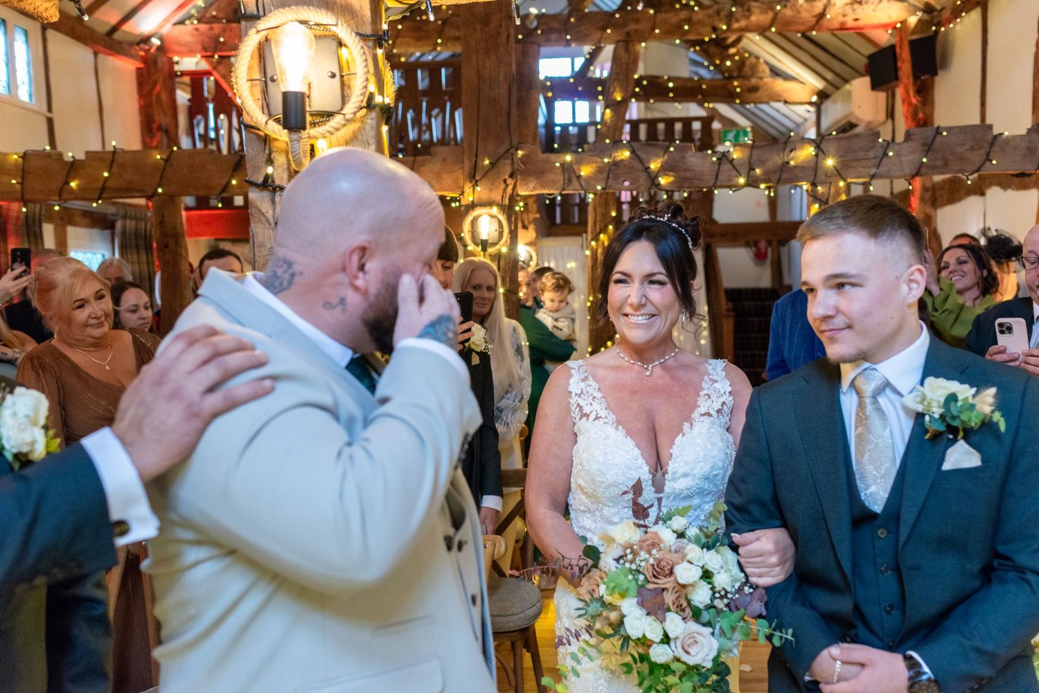 Emotional wedding first look at The Plough Inn, Eaton; candid barn ceremony photography in Cheshire by Michael Pardoe.