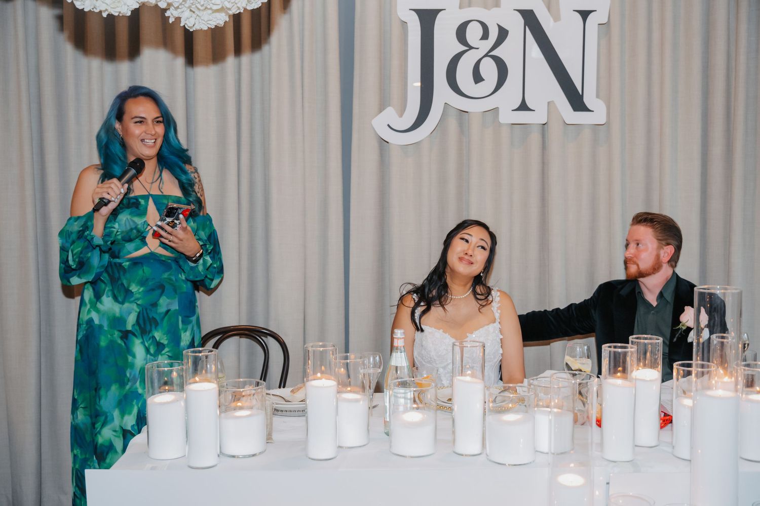 Wedding ceremony and reception moments captured with bridesmaids in sage green dresses at an outdoor venue.