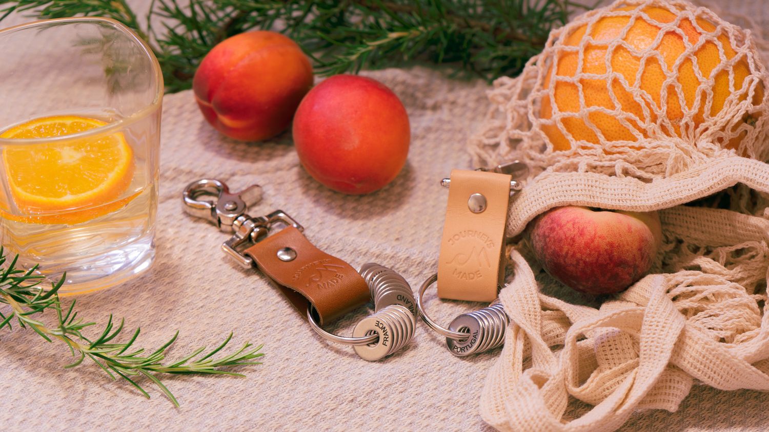 Fresh citrus fruits and oranges arranged with rustic decorative elements for product photoshoot.