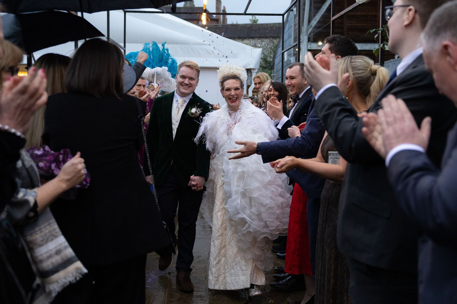 Couples dancing together at an elegant wedding reception in formal attire.