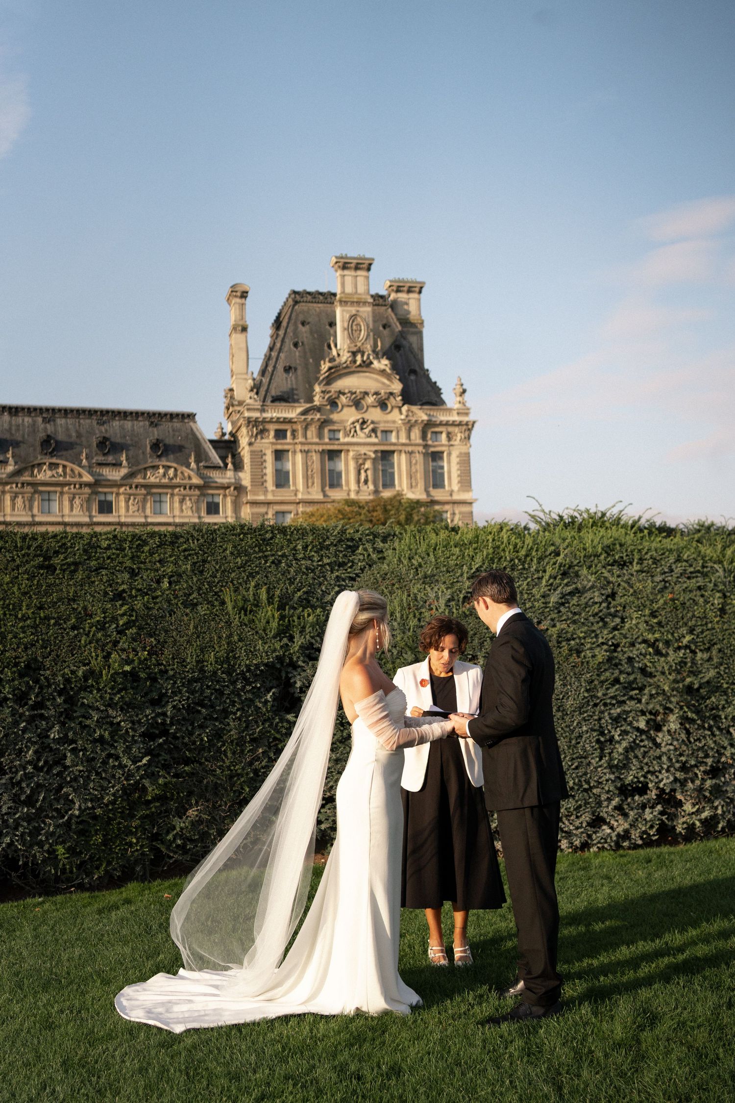 Black and white striped columns stand in a row at the Palais Royal courtyard in Paris, France. Tuileries wedding. Paris elopement.