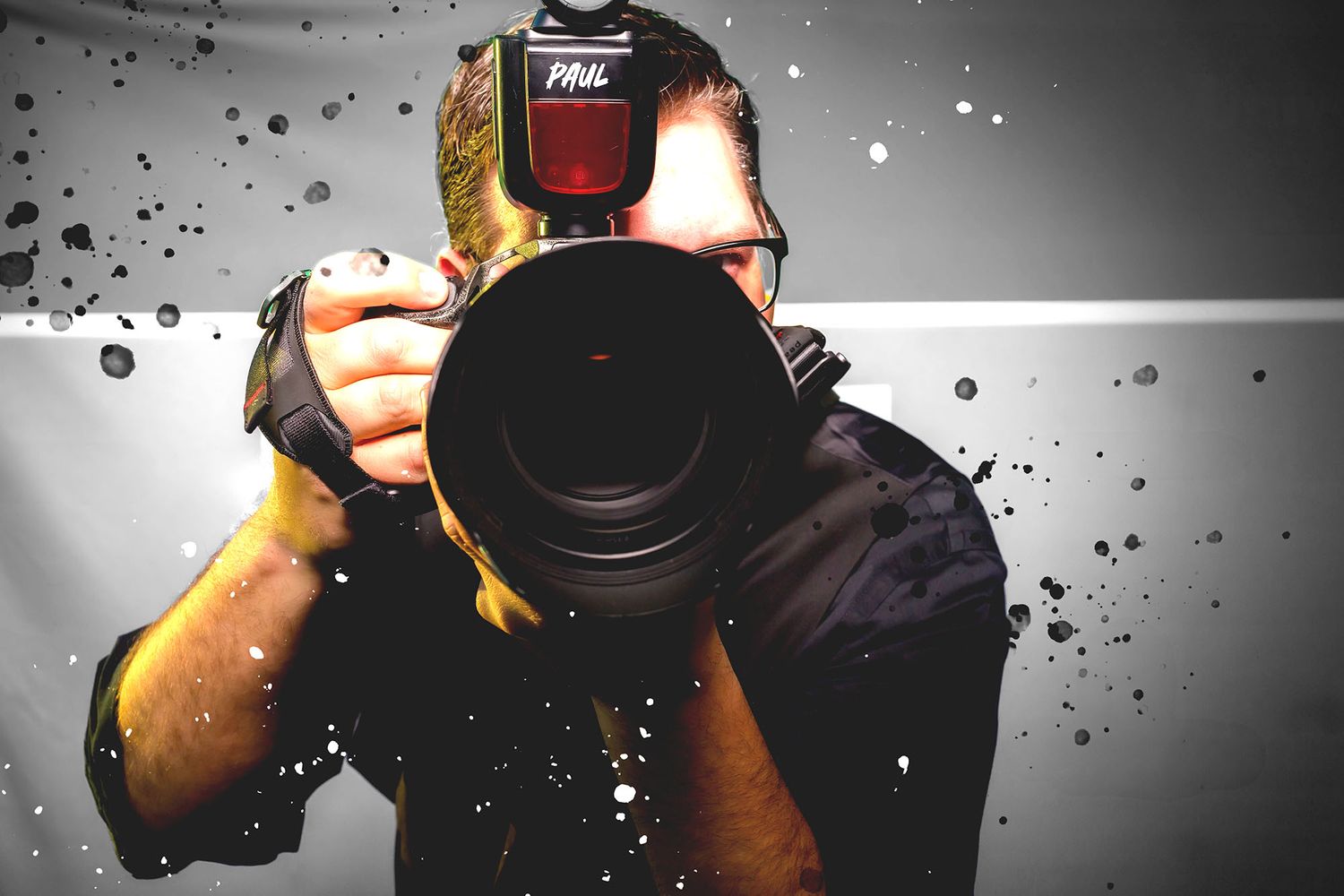 Camera operator in low-light setting adjusts professional video equipment with blue accent lighting in background.