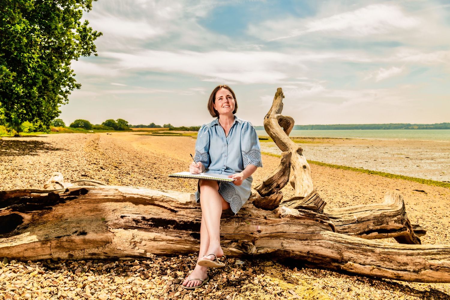 A Personal branding portrait of plant seed business owner Kate Cotterill on the Holbrook coastline, Suffolk.
