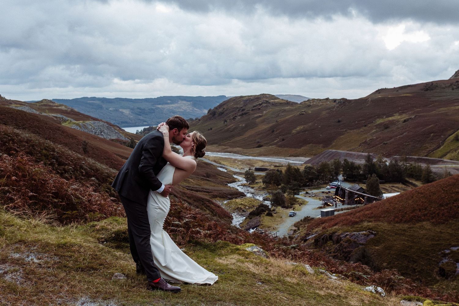 Bride and Groom embrace as it goes dark at Coniston Coppermine's