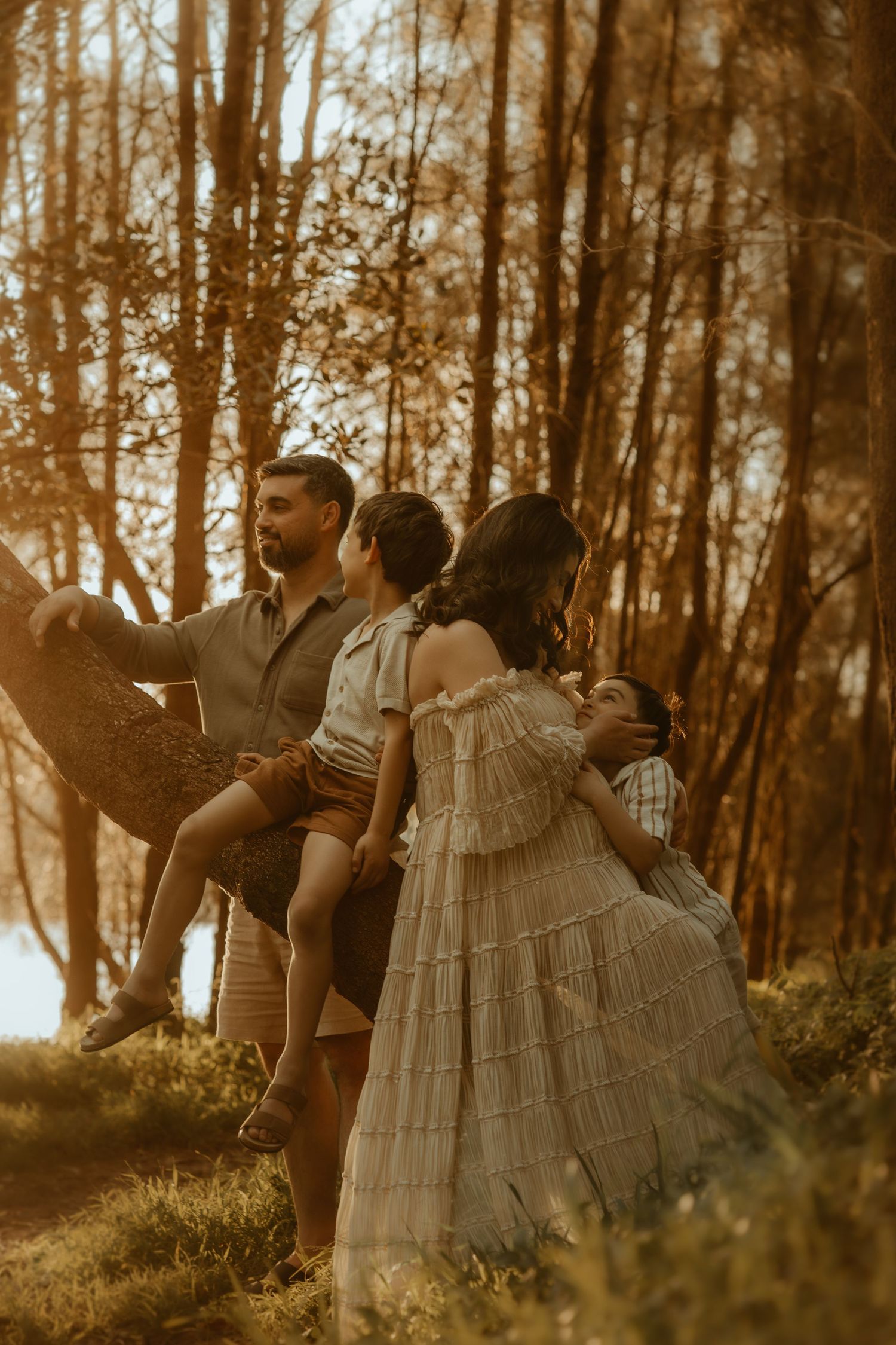 A romantic sepia-toned photo series showing a couple dancing together in a dreamy forest setting.