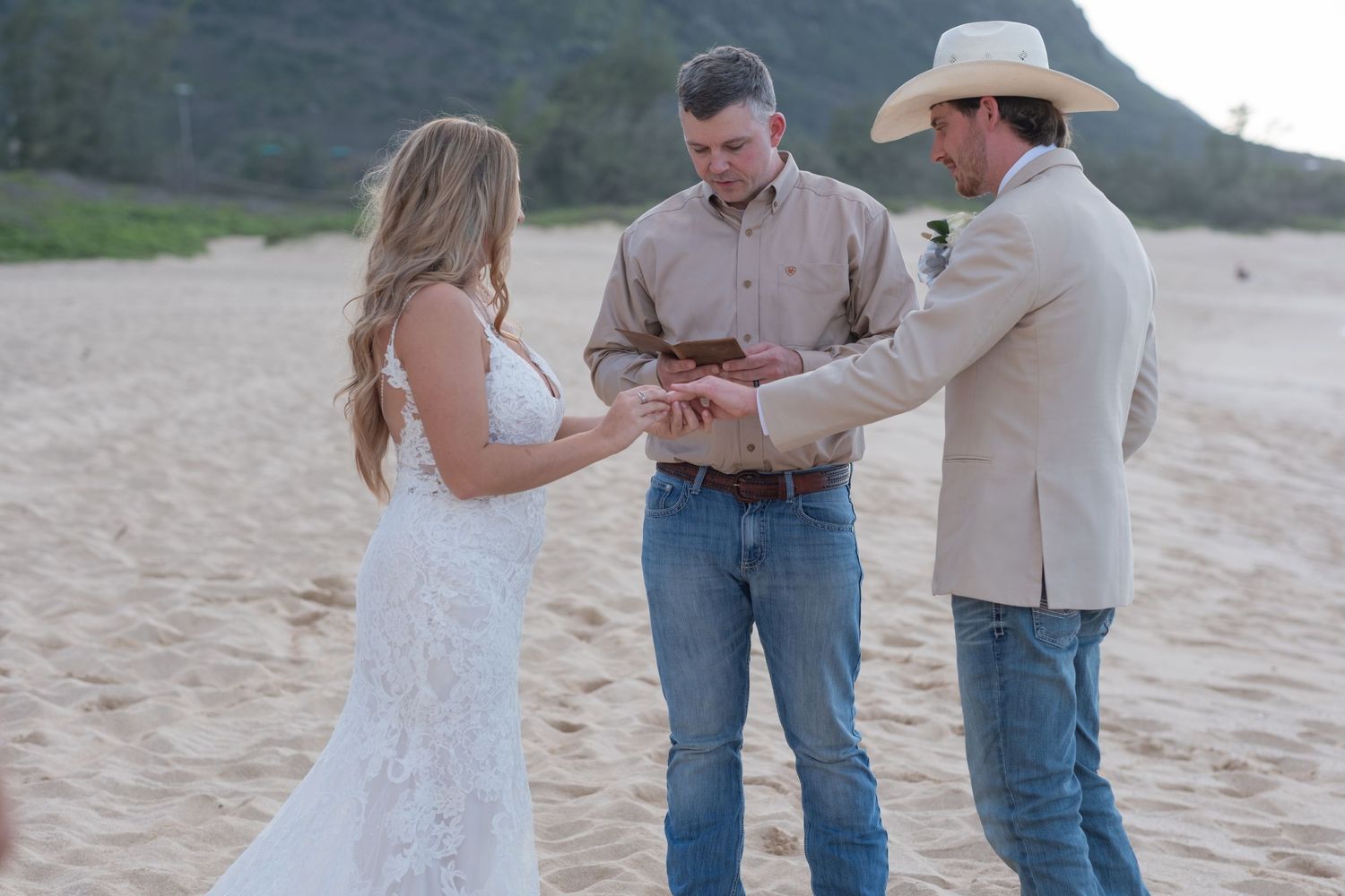 Couple exchanging vows during an intimate Hawaii beach elopement ceremony on Oahu's North Shore.