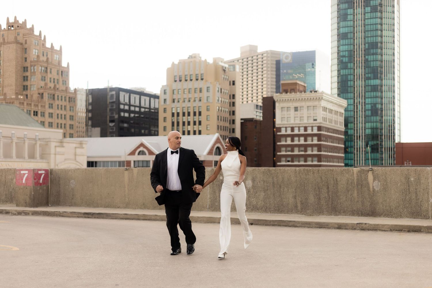 Photo session locations for downtown Fort Worth Texas, with a couple on a parking garage roof top near Bass Hall.