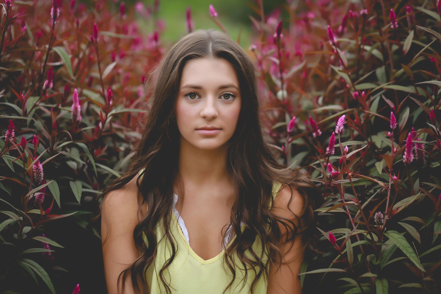 Portrait series against burgundy foliage with soft natural lighting.