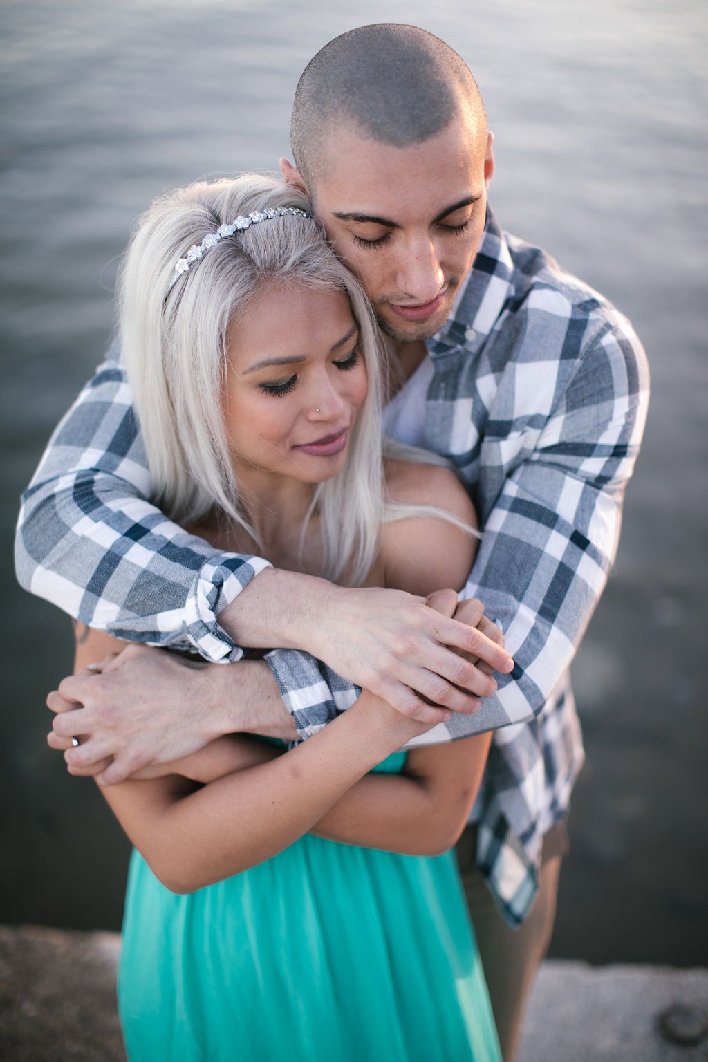 woodbine beach lake ontario engagement session couple hugging