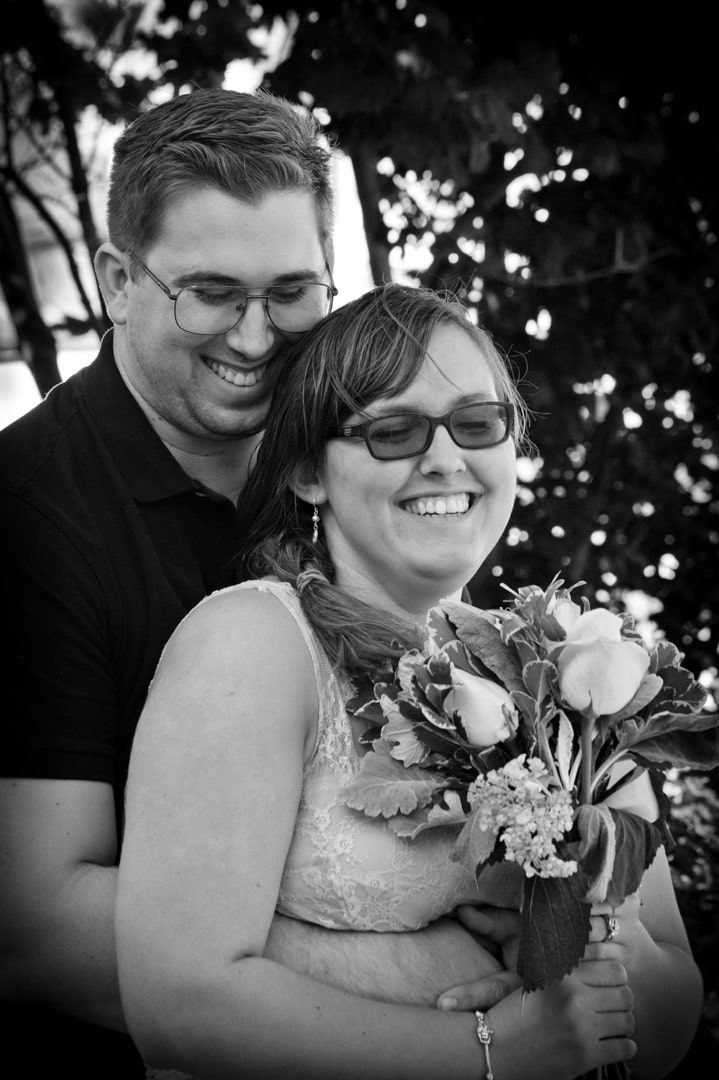 Headshot of bride and groom during their wedding at the Tacoma Glass Museum.