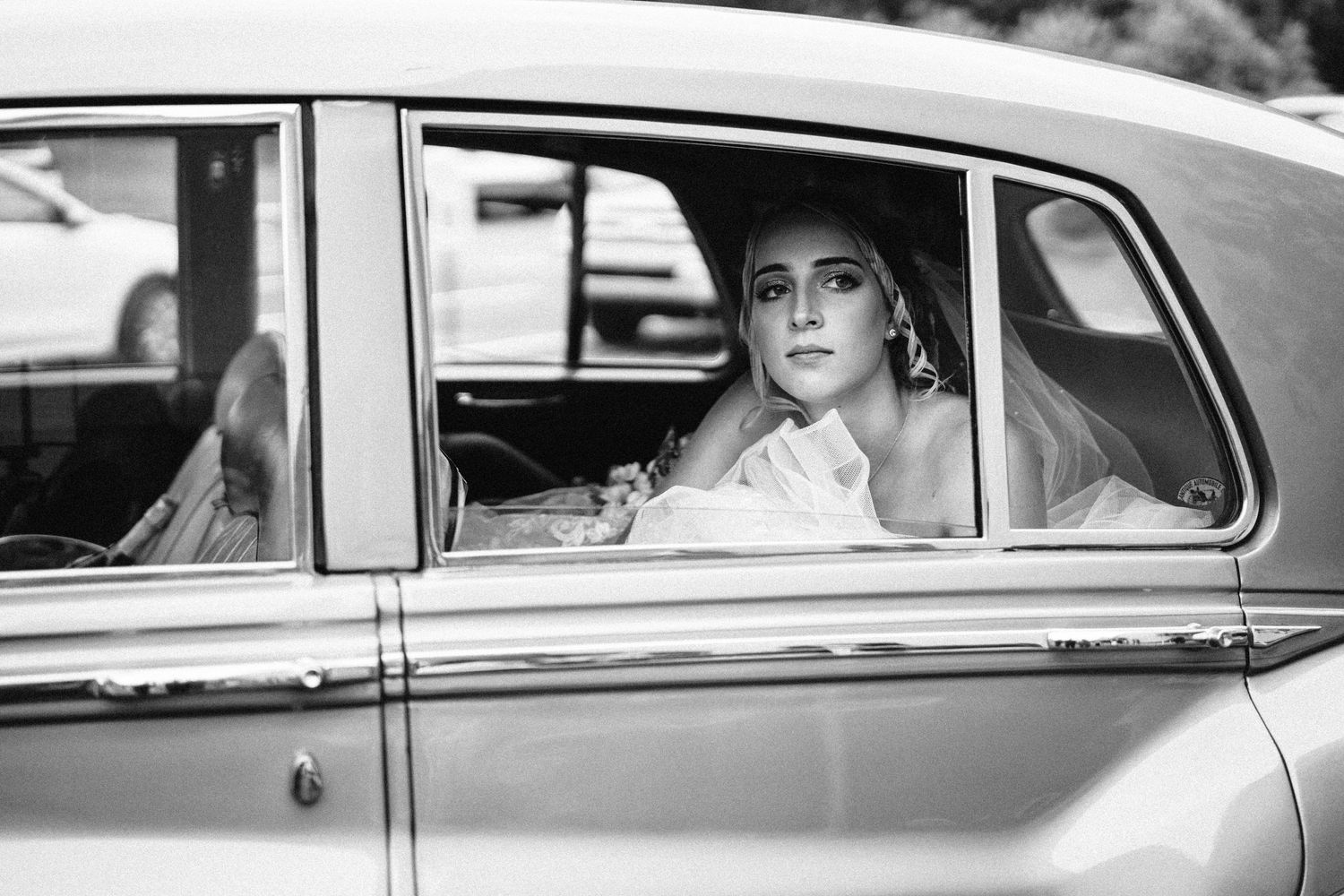 A classic vintage car interior shot in black and white.