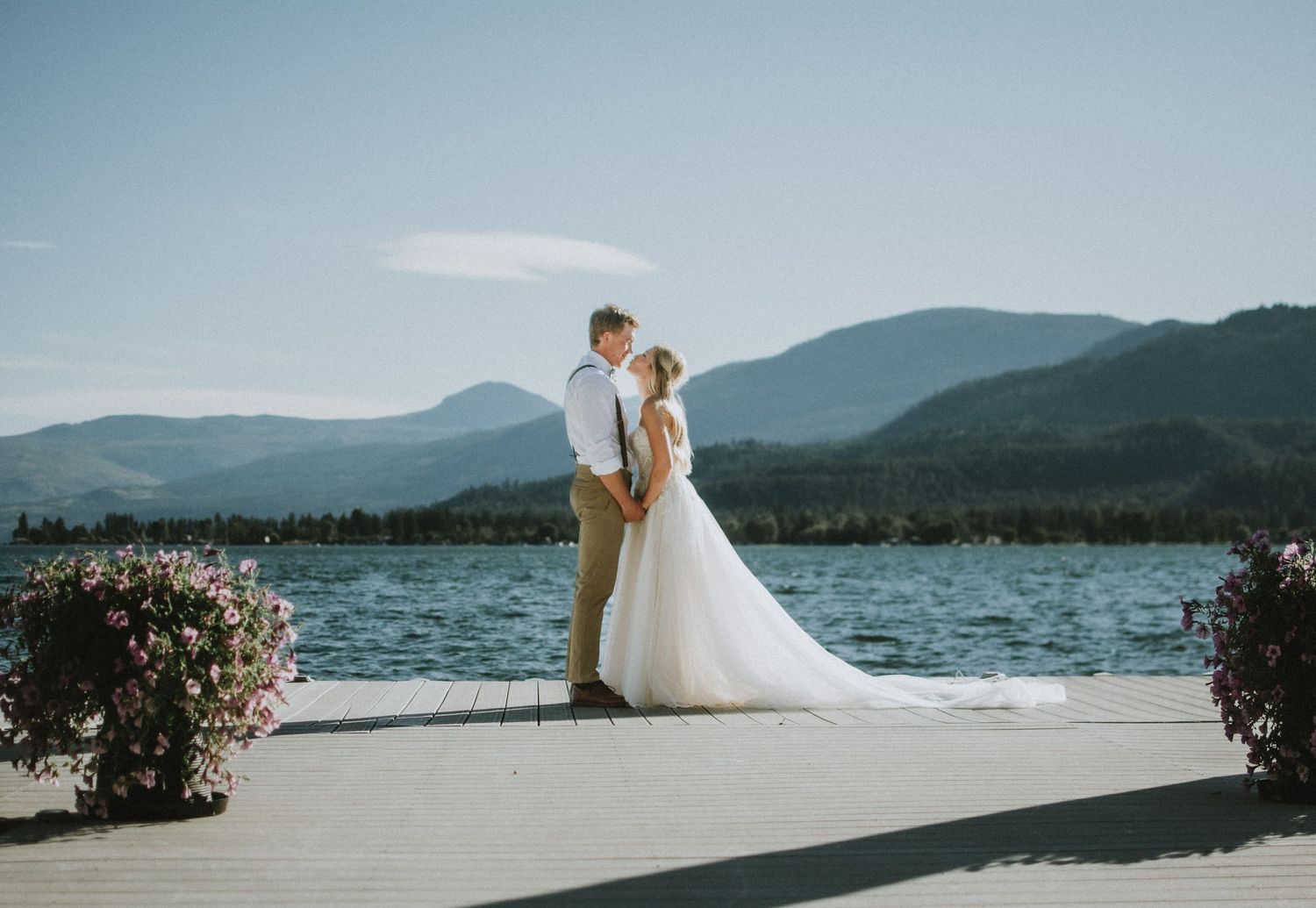 Vernon Wedding photography, photo of bride and groom on a dock kissing