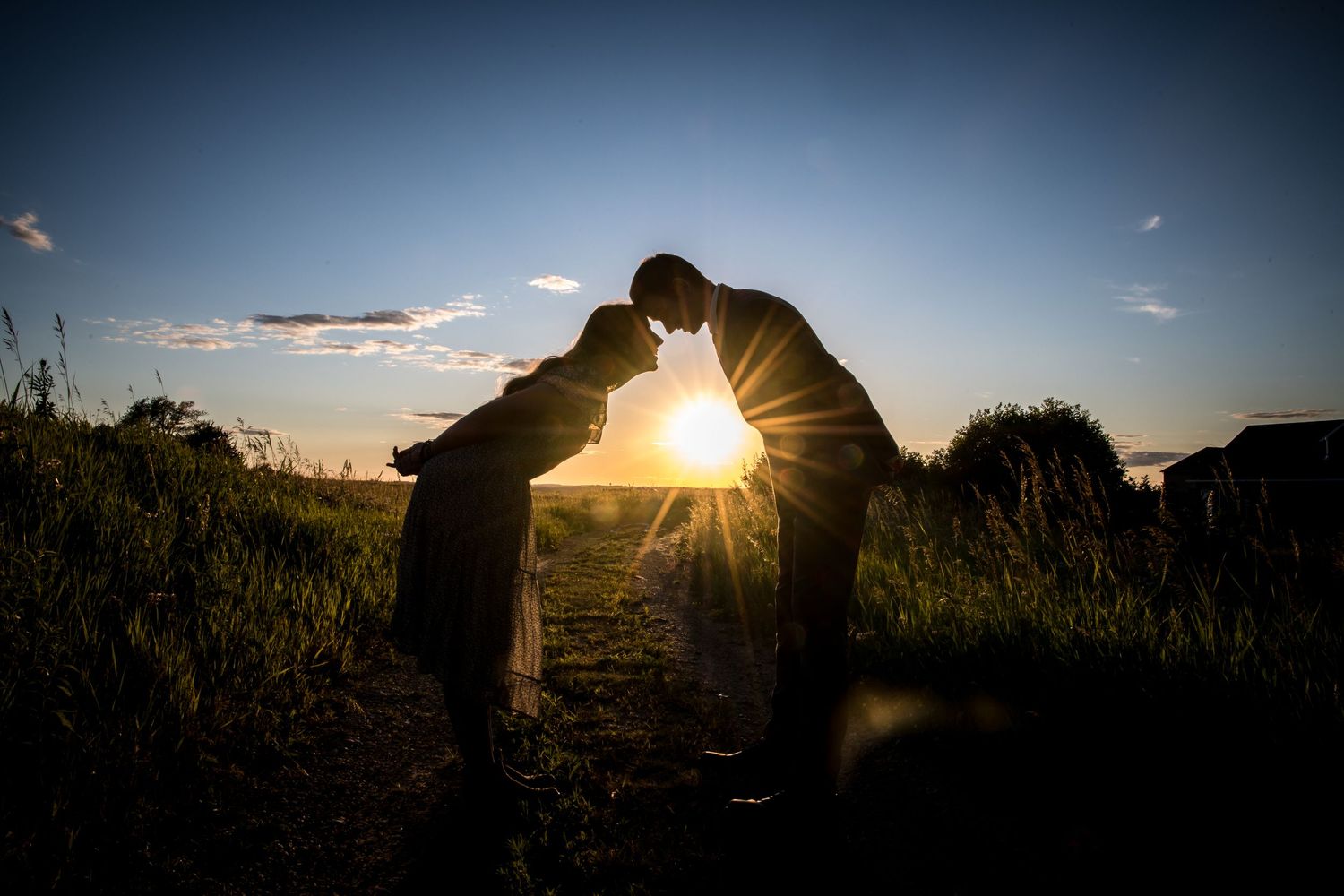 Silhouette of a brother and sister.