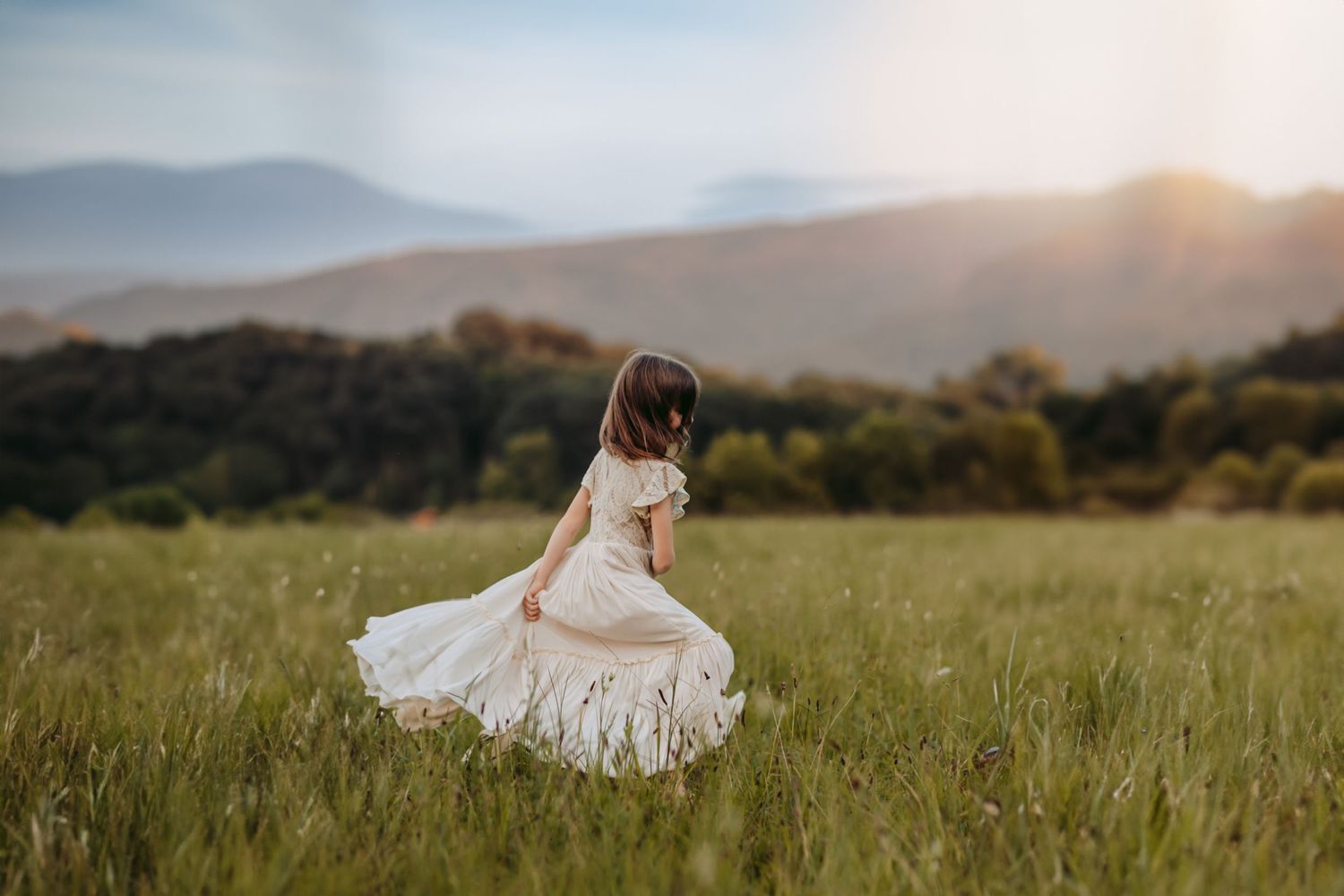 Girl twirling in dress in the Smoky Mountains
