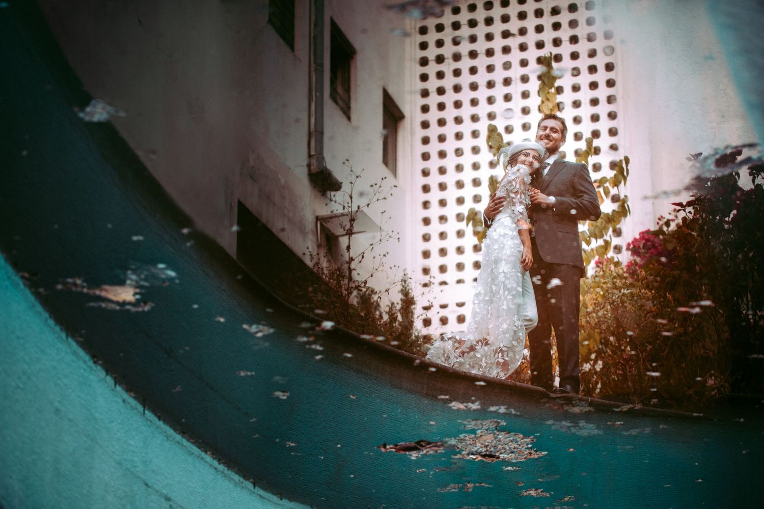 Artistic silhouettes of people walking through a modern architectural space.