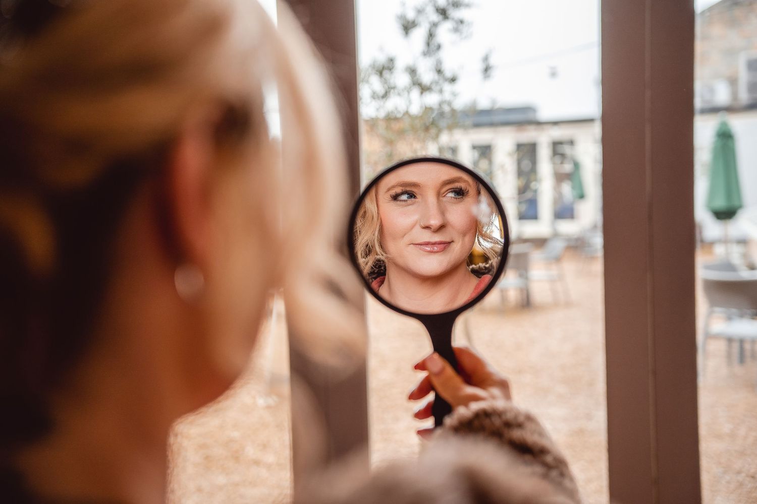 Close-up shots of wedding day preparations in soft natural lighting.