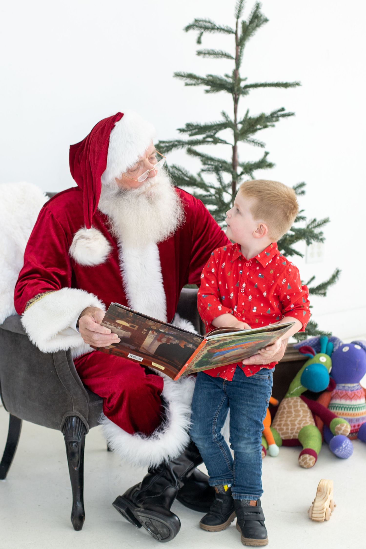 A series of holiday photos showing a person in red velvet and white fur reading a book with toys nearby.