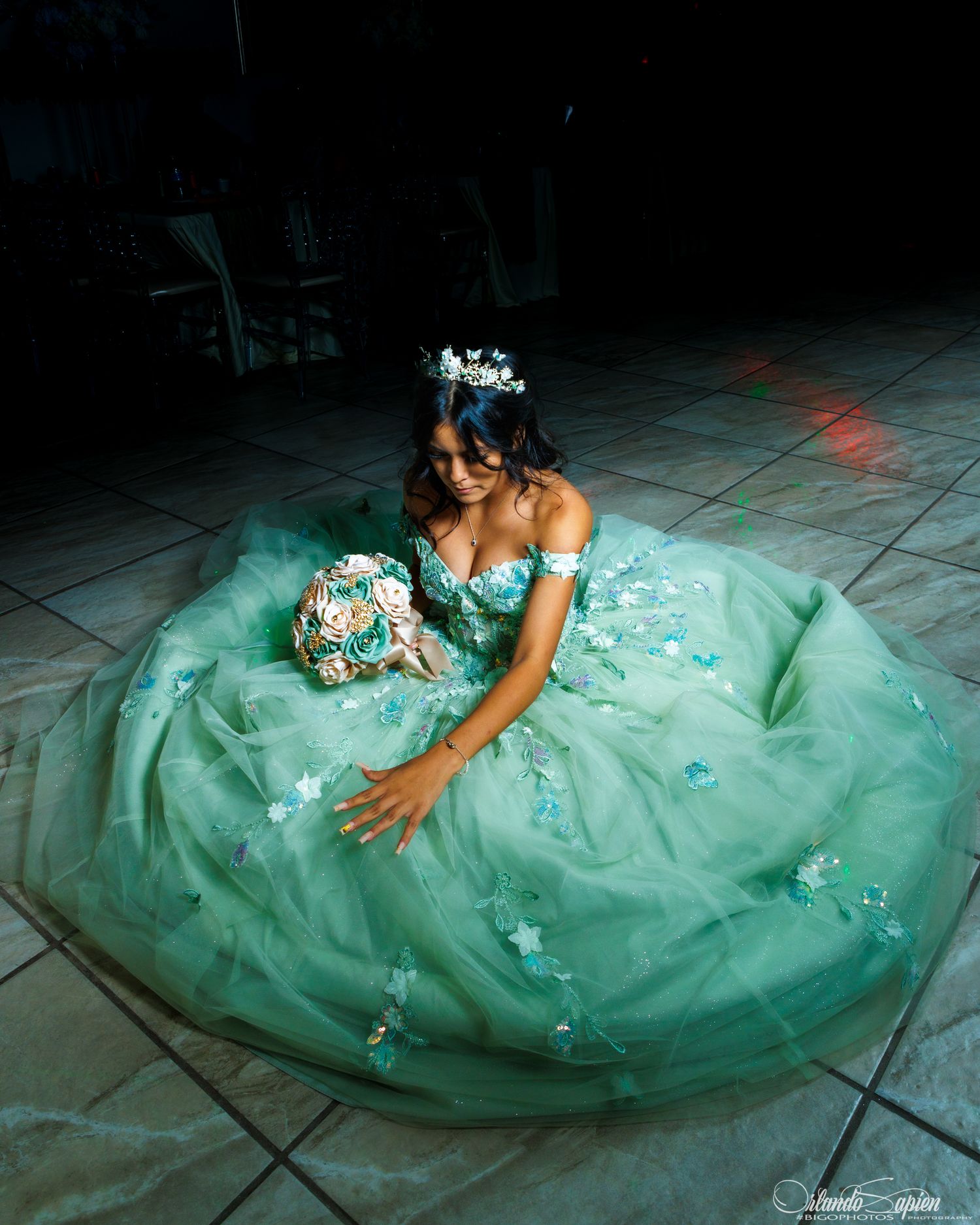 Artistic floor-length shots of a mint green formal dress with sparkle details.