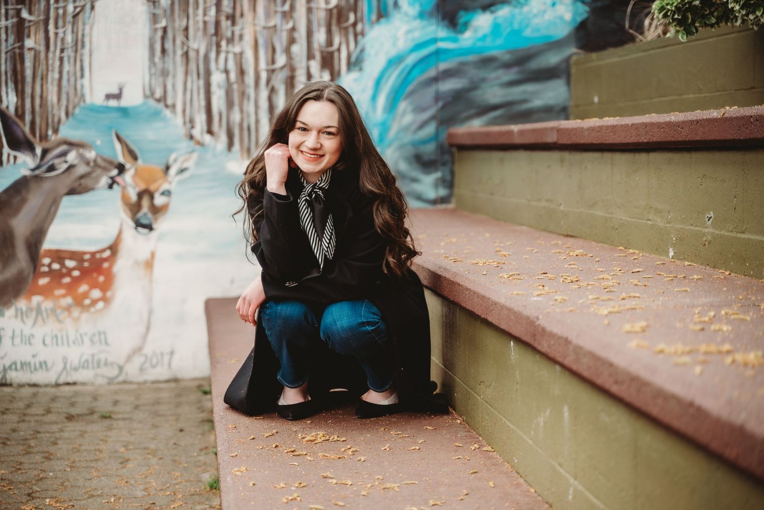 senior girl poses in front of mural downtown mount vernon, wa