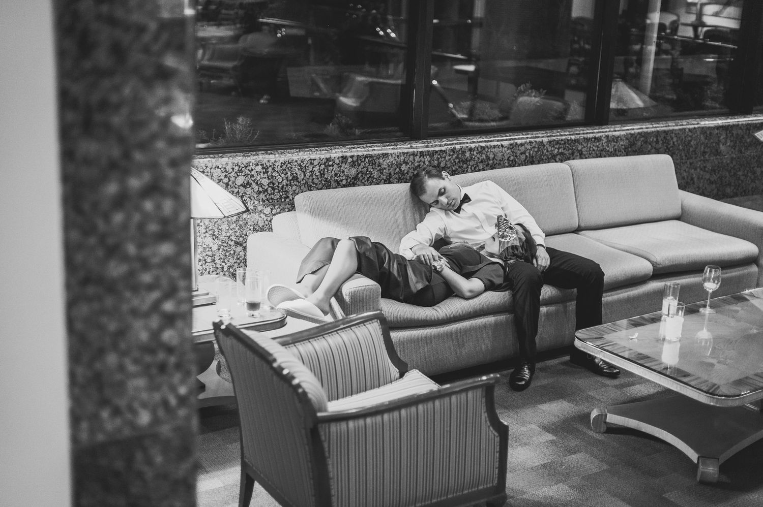 Wedding guest sleeping on couch.