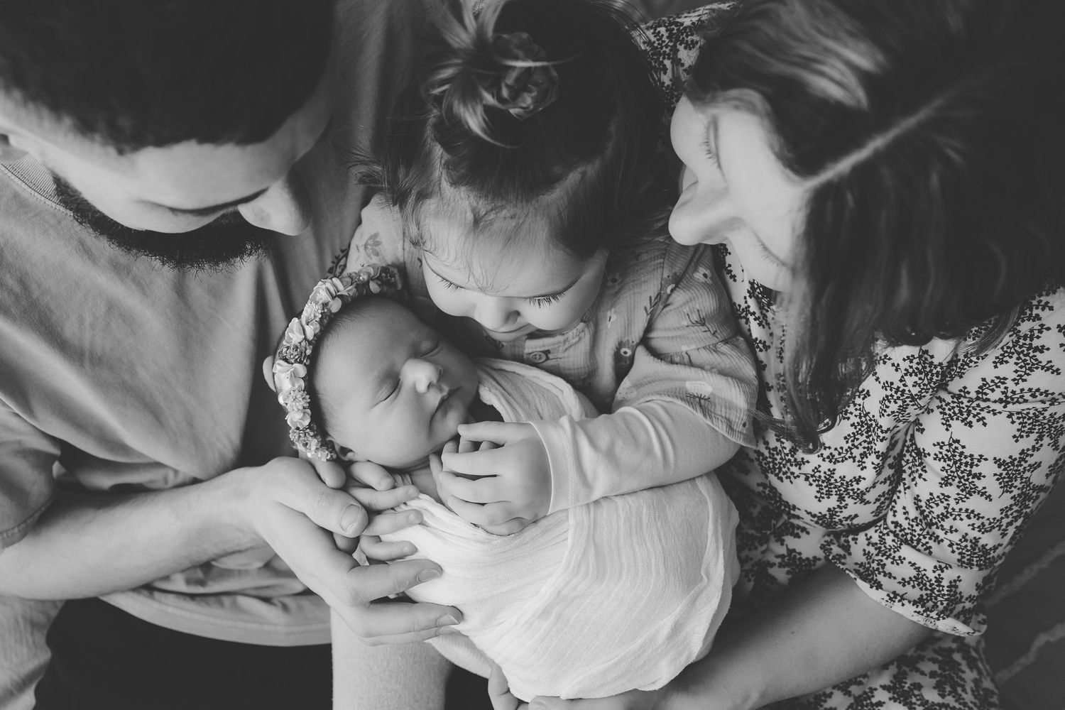 A collection of black and white intimate moments showing tender interactions between parent and child.