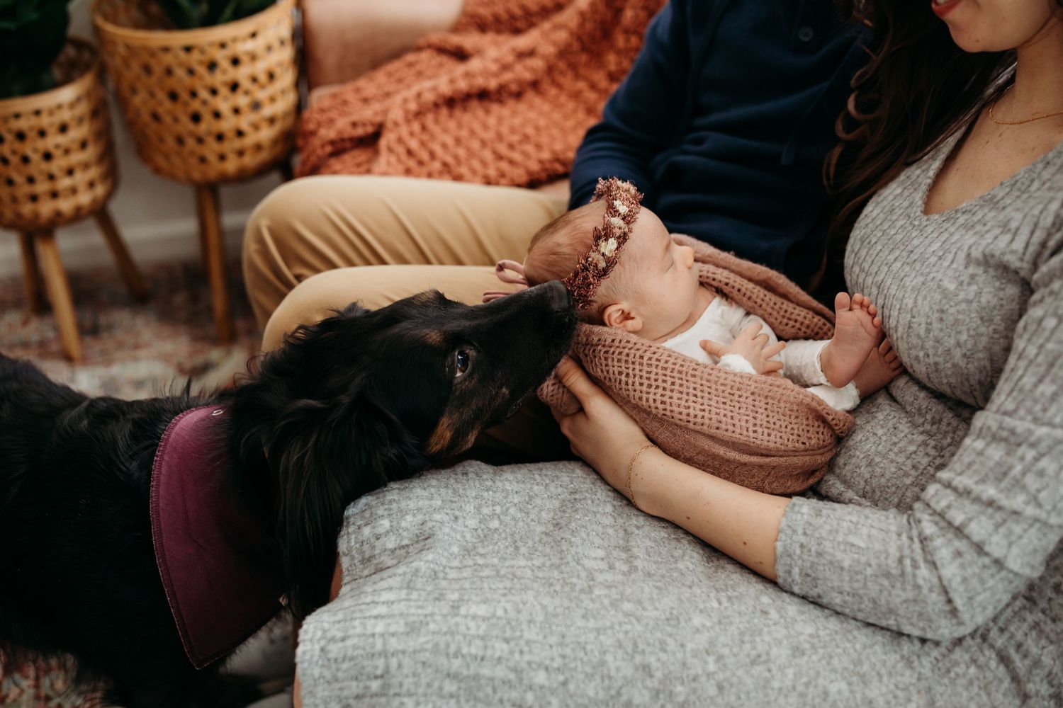 A cozy home lifestyle session featuring a baby with knit accessories and warm natural lighting.