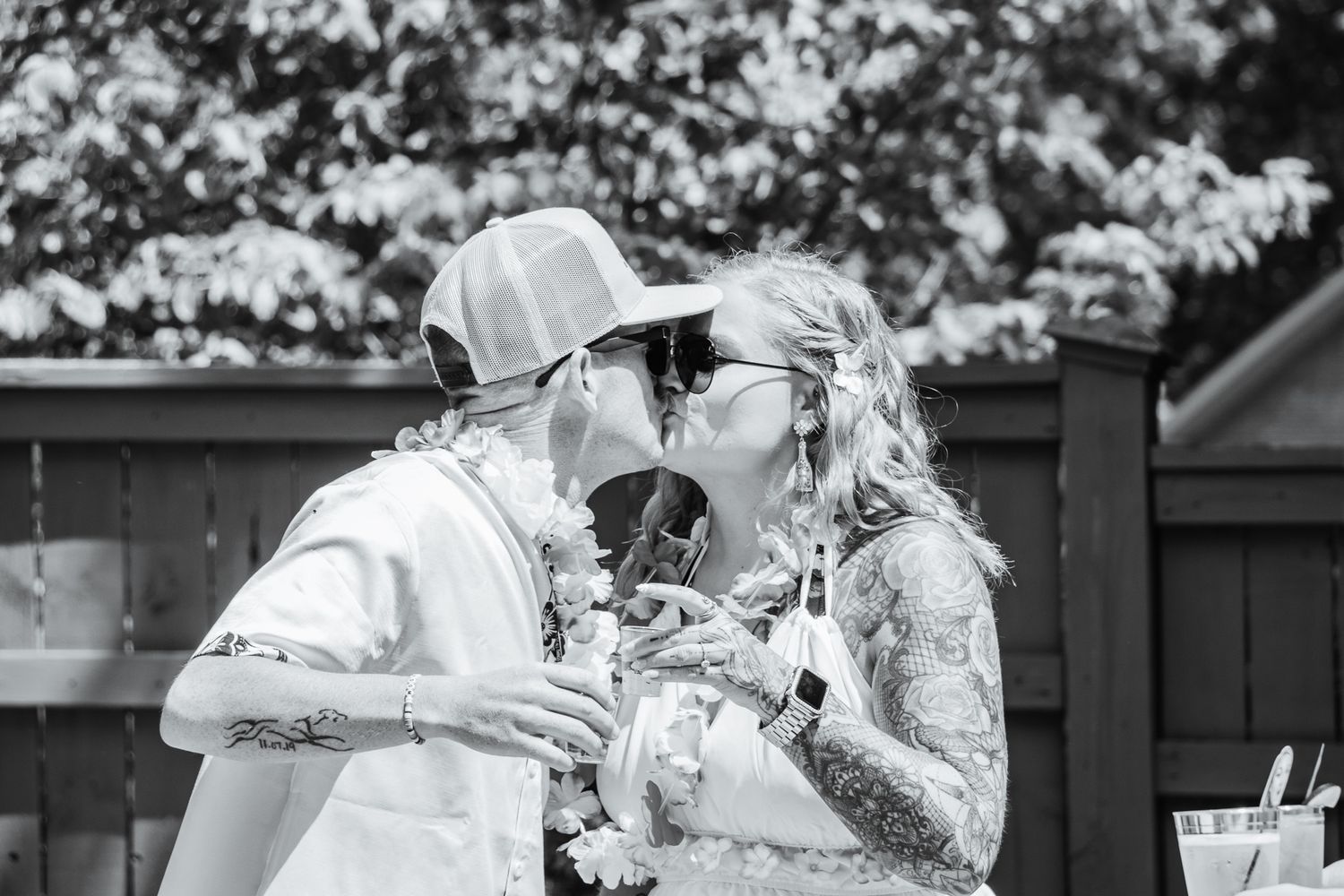 A Luau Wedding Party | Black & White image of couple kissing | K Murphy Photos | Roanoke, Virginia | Wedding & Event Photography