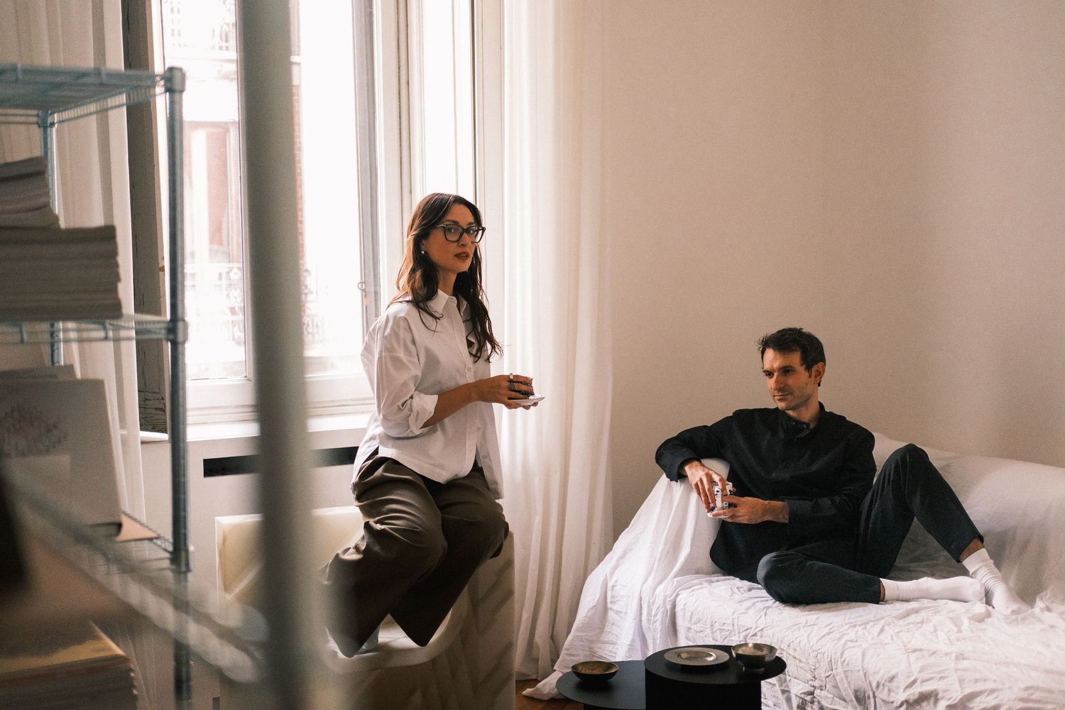 A series of photos showing a couple relaxing and working together at home in natural light.
