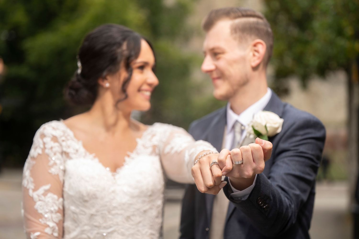 Romantic wedding couple shares intimate moments together in multiple poses outdoors during their special day.