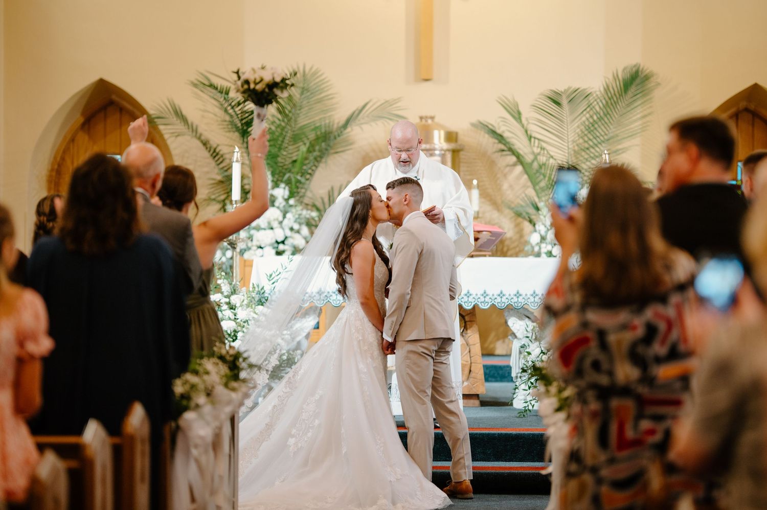 A bride in a flowing white dress poses gracefully outside a stone church building in various romantic settings.