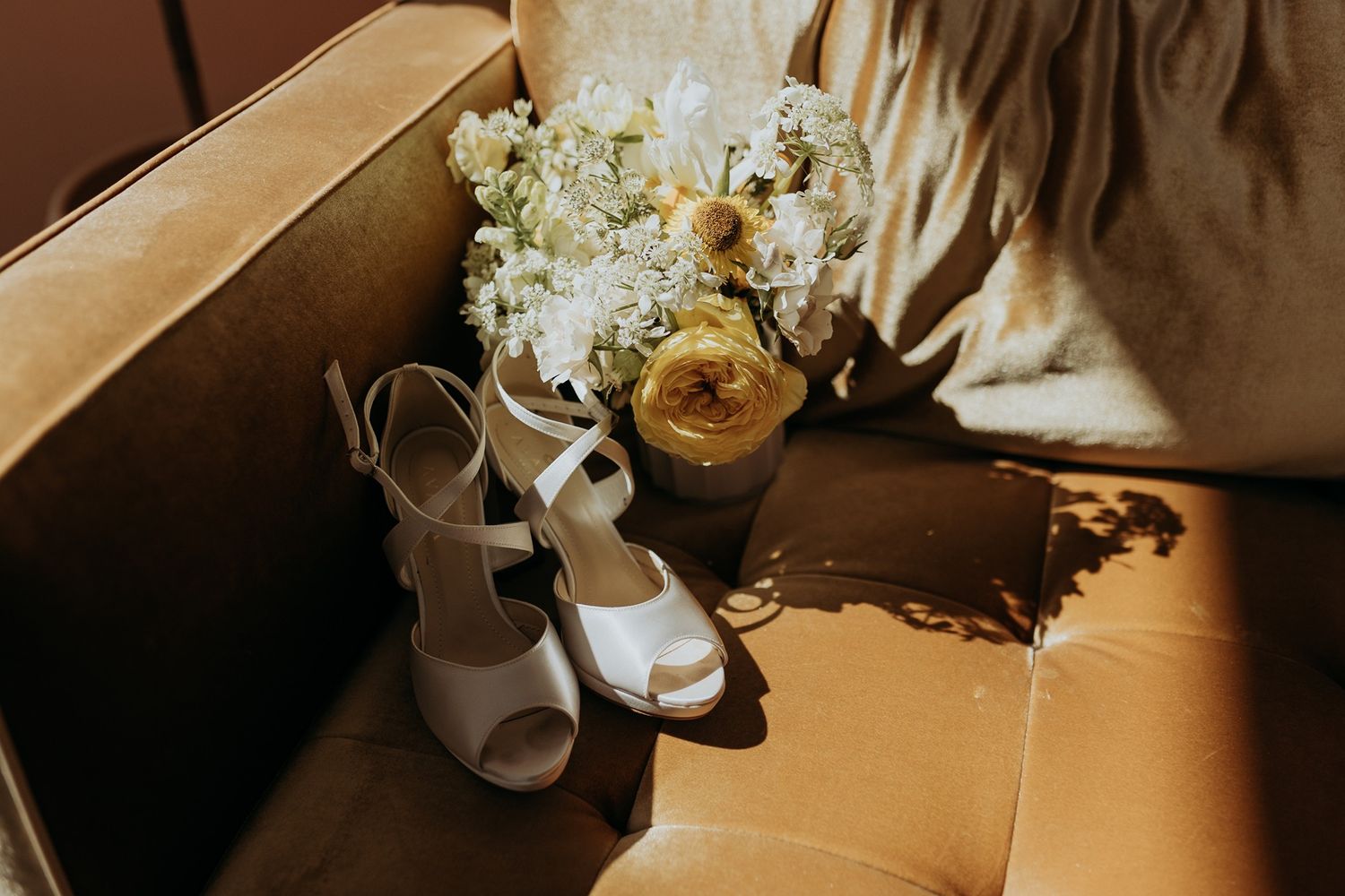 Wedding details with floral arrangements and decorative elements in warm lighting at The Lane.