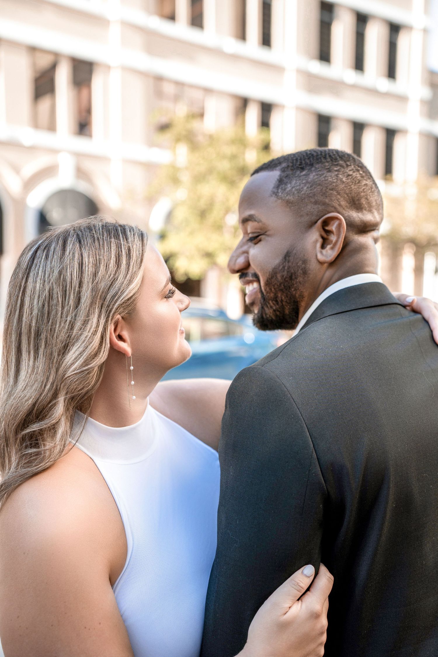 A couple shares an intimate moment together in formal attire during an outdoor event in Downtown Tampa