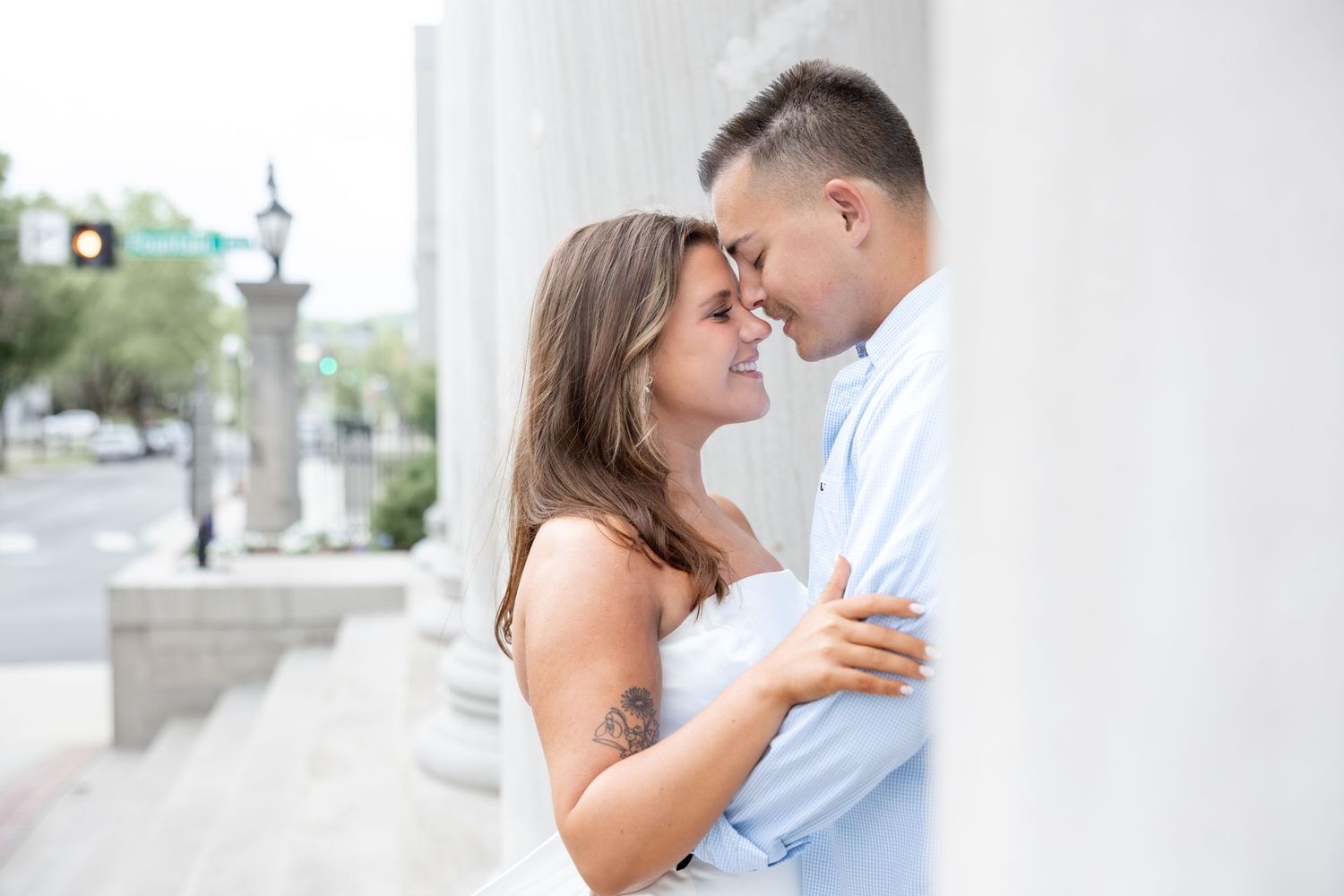 Downtown Huntsville engagement session at First National Bank and Big Spring Park by Julia and Sean Photography, capturing joyful moments.