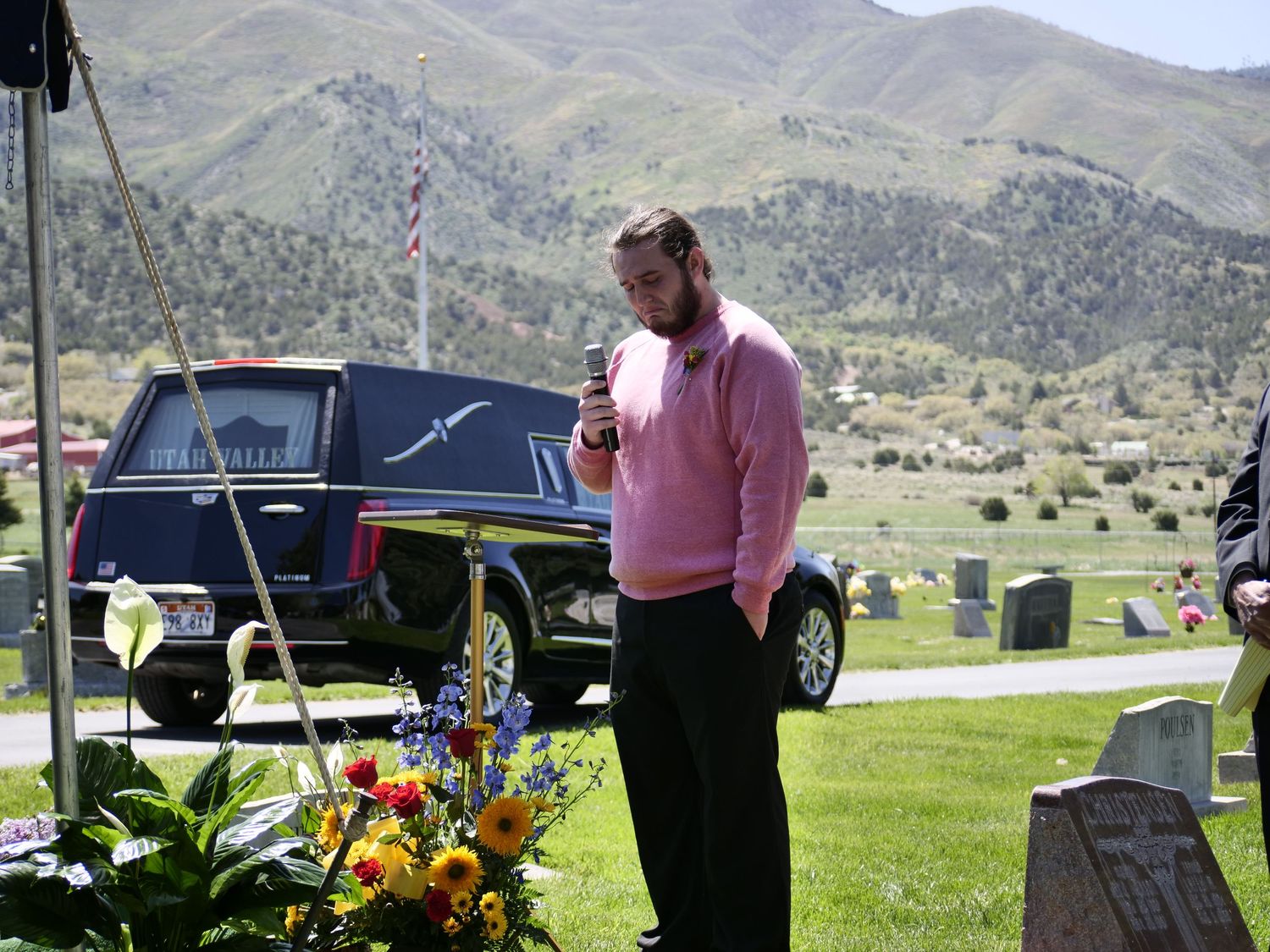 A young man delivers a heartfelt story at the graveside service.