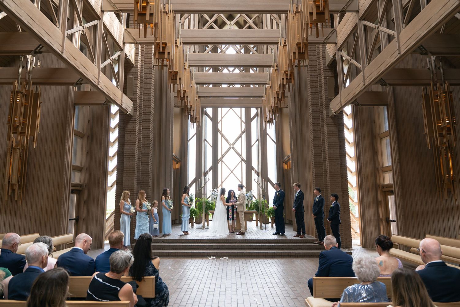 Luxury DFW wedding ceremony featuring elegant architecture and decor