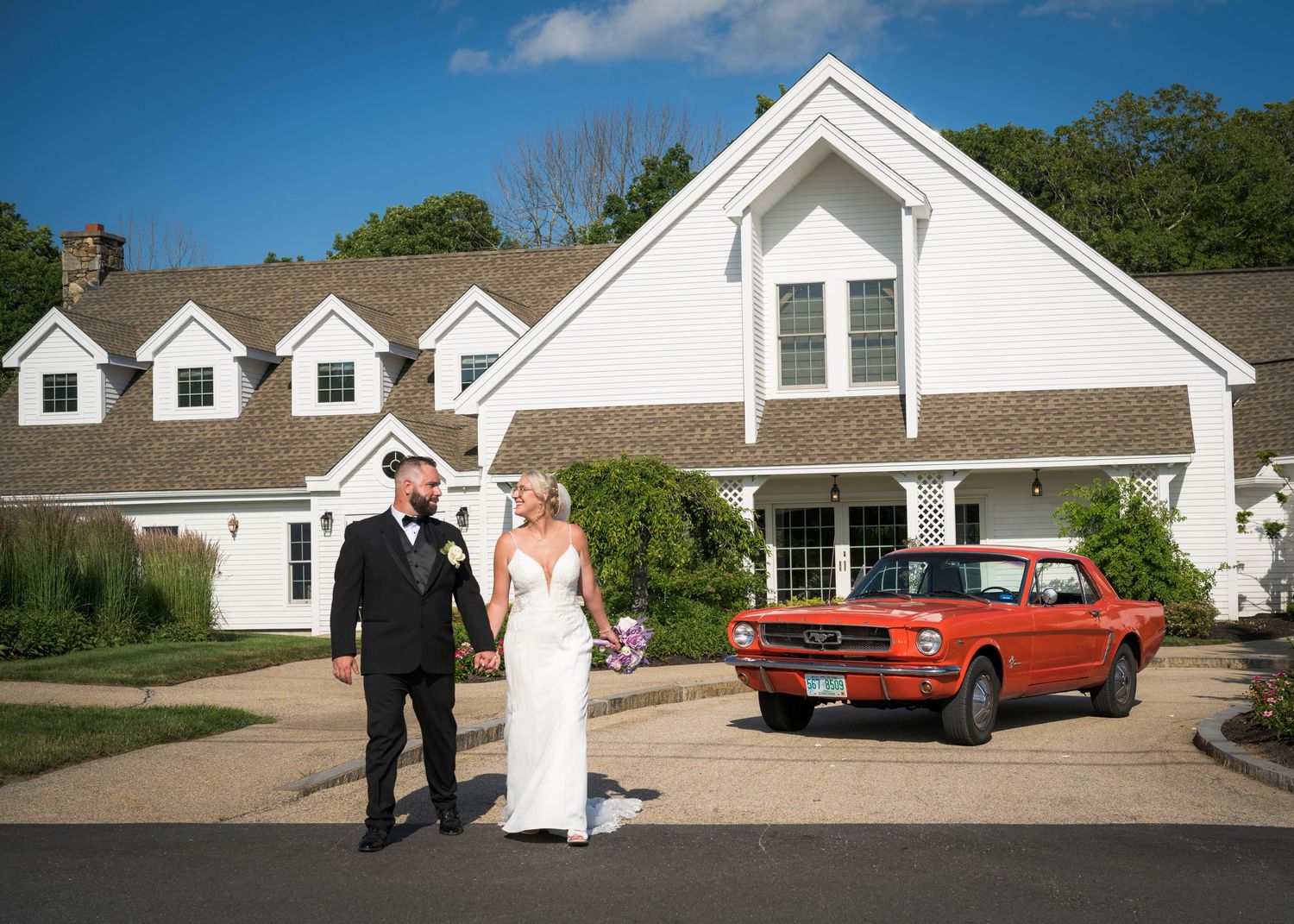 Gothic church interior wedding ceremony with stained glass windows and crucifix above the altar.