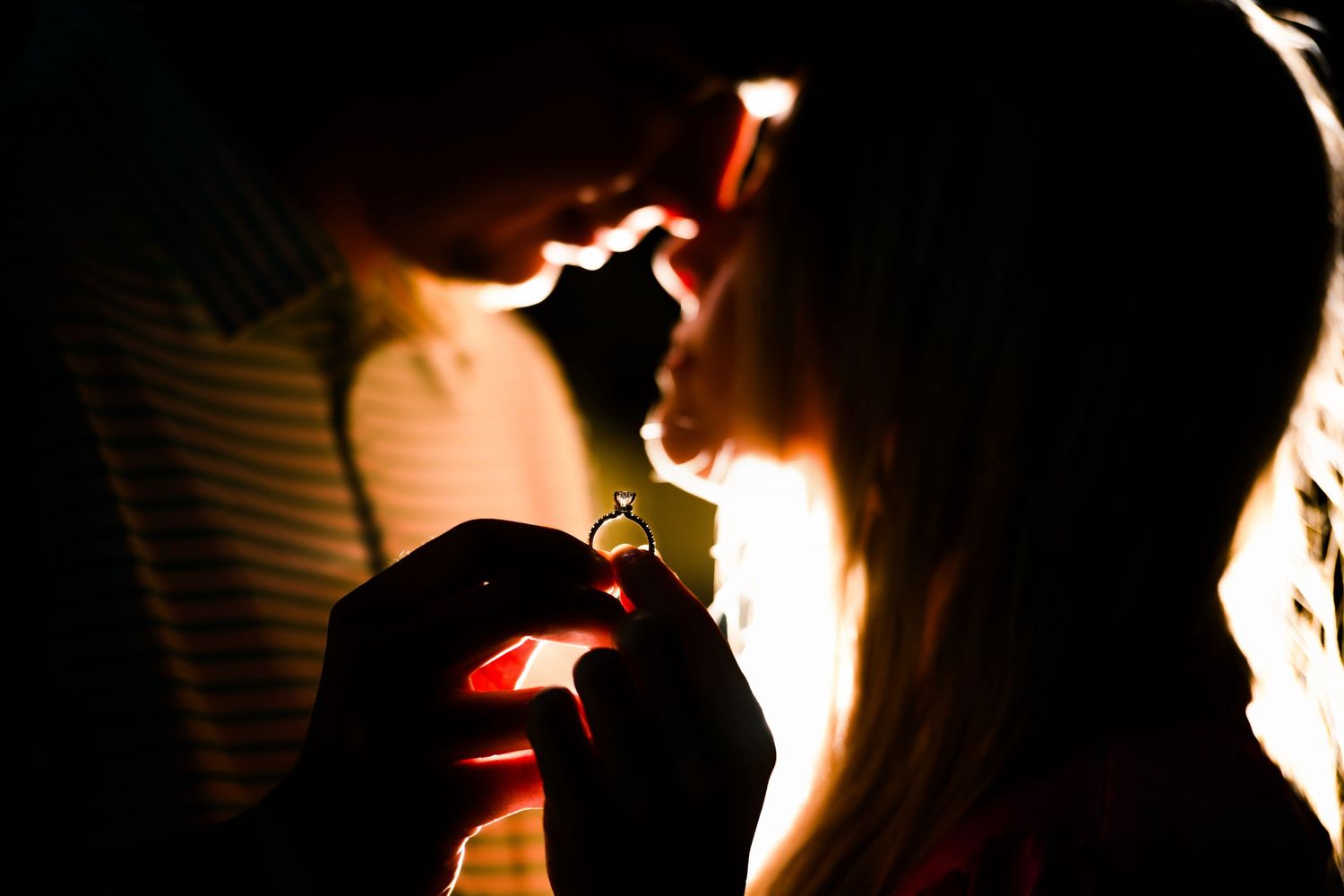 Silhouette of couple in intimate moment with backlit glow. Myrtle Beach Photographer