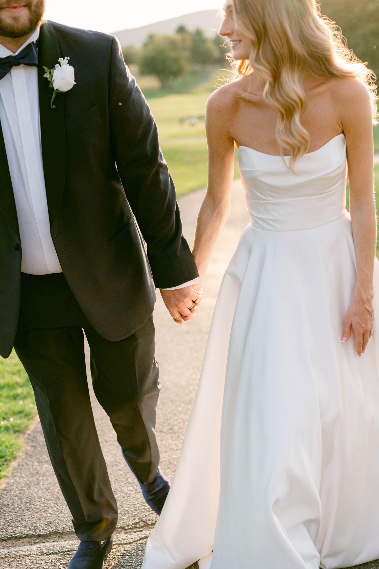 Just married couple embracing at elegant wedding venue with period artwork and windows at the DAR Constitution Hall in Washington DC.