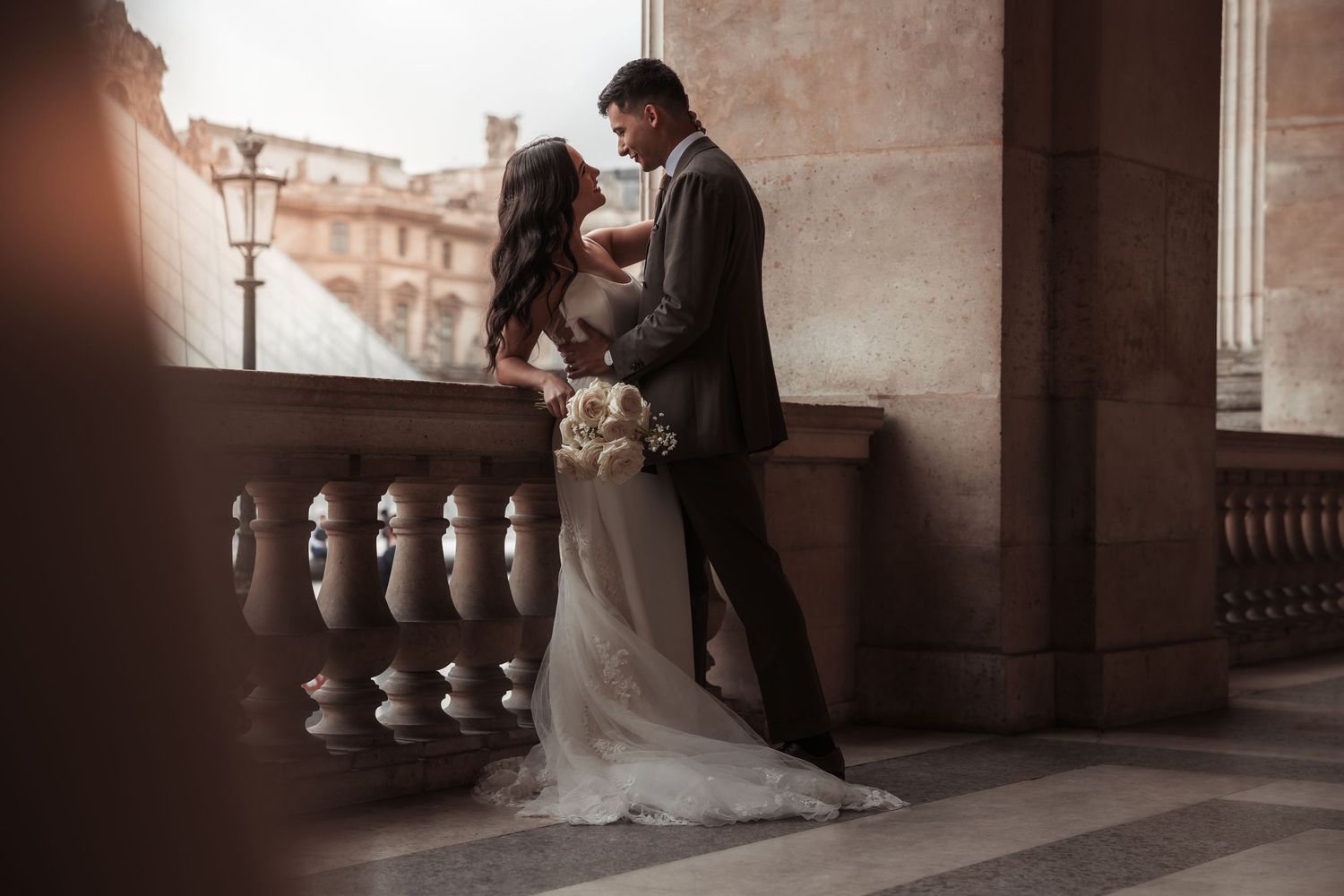 Elegant historic mansion with ivy-covered walls and manicured gardens features French chateau-style architecture details.