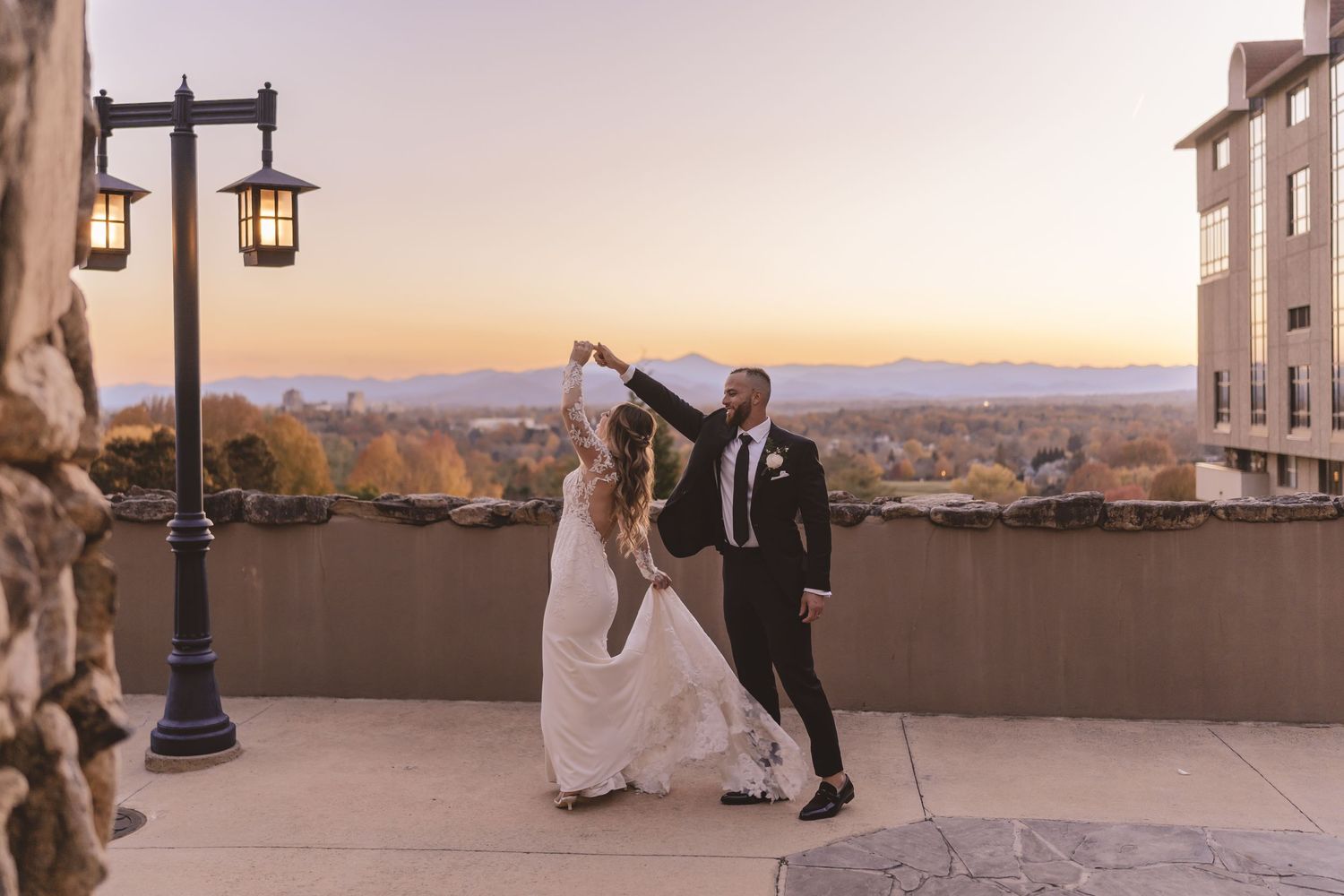 Omni Grove Park Inn wedding sunset photos in Asheville, North Carolina with bride and groom dancing.